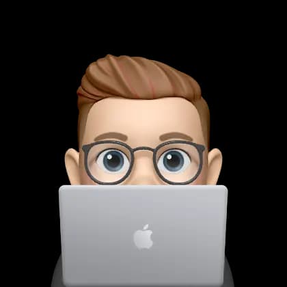 Ashish Prabhakar memoji working on a laptop